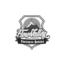 A tranquil valley with flowing water and lush greenery